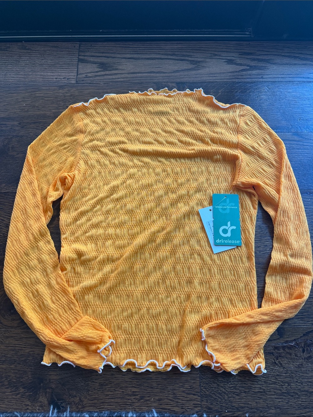 drirelease® Women's Long Sleeve Lettuce-Edge Top in Marigold